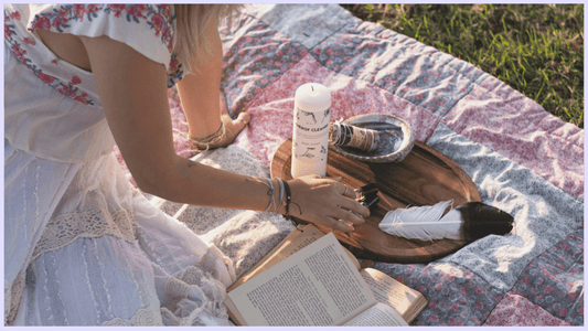 A woman performing energy cleansing ritual using the energy cleansing kit from Mary Armendarez.