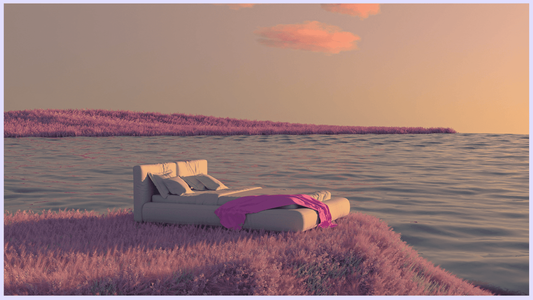 A bed surrounded with flowers, near the beach.