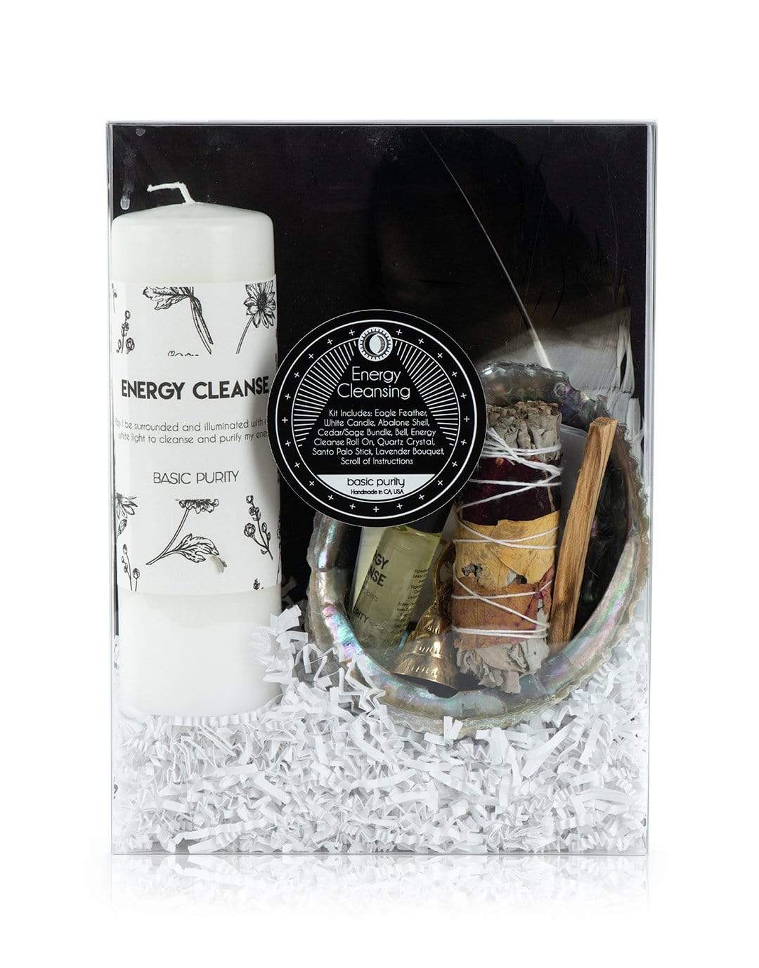 The energy cleansing kit by Mary Armendarez. This includes eagle feather, white candle, abalone shell, cedar/ sage bundle, bell, energy cleanse roll on, quartz crystal, Santo Palo stick, lavender bouquet, and ritual instructions.